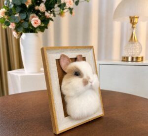 White rabbit needle-felted portrait in a gilt frame