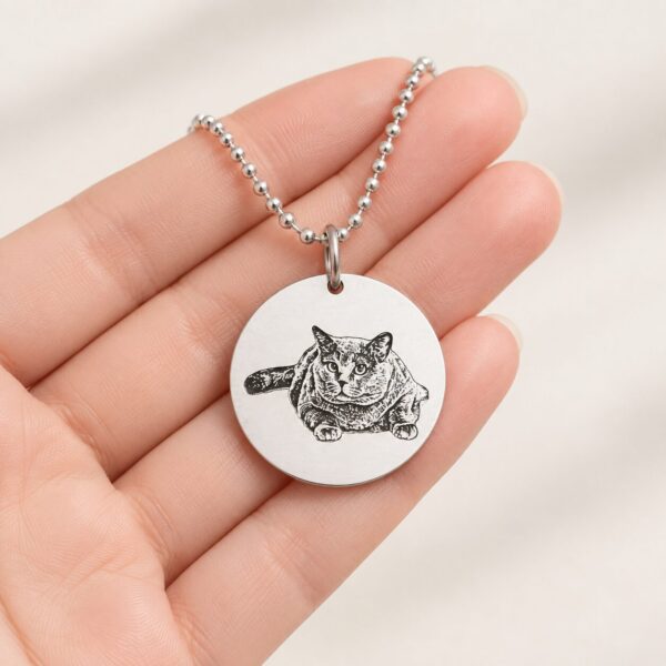 Silver Memorial Pendant — resting in an open hand Silver Memorial Pendant — resting in an open hand