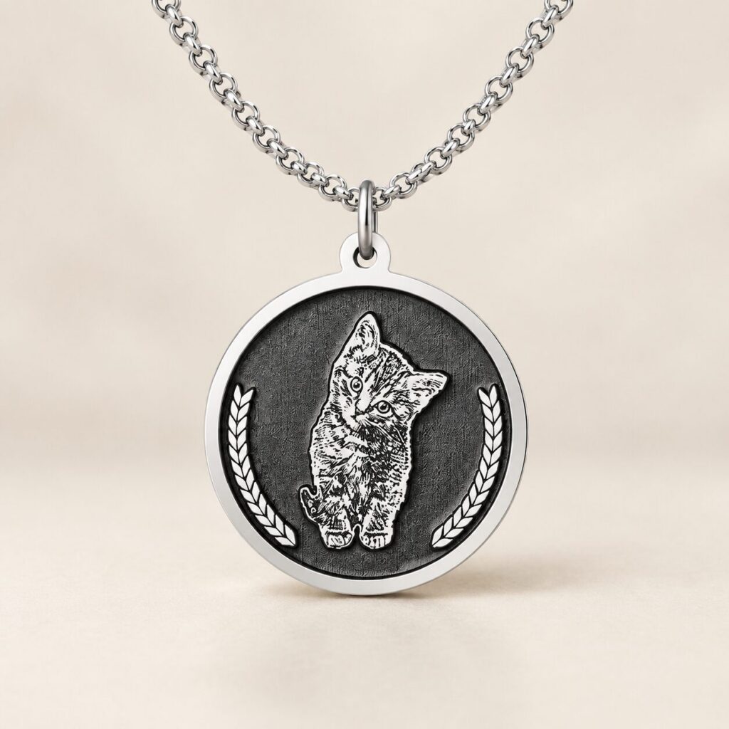 An engraved sterling silver pet pendant on a chain