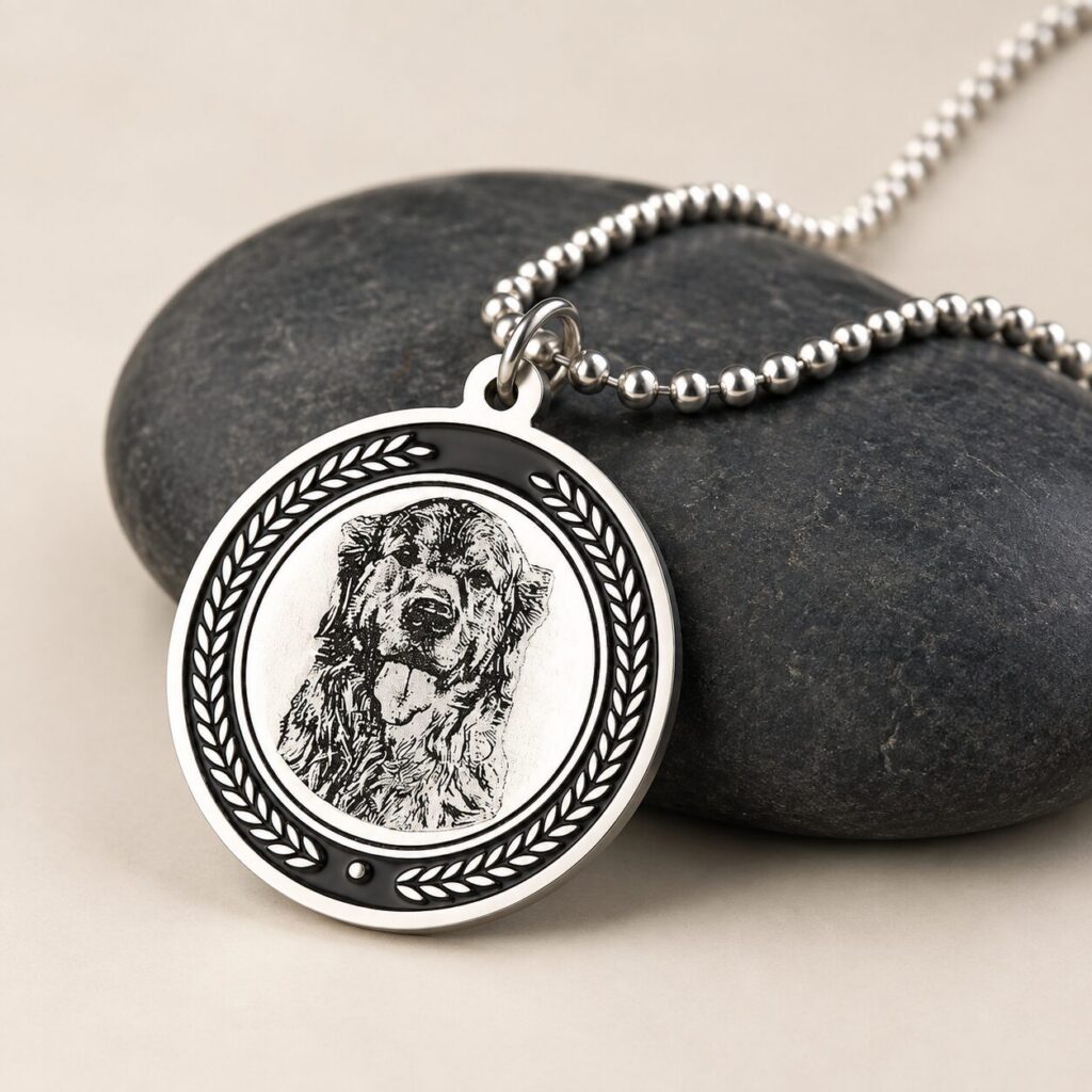 Silver Memorial Pendant — pendant resting on dark stones