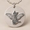 Silver Memorial Pendant — close on the engraving Silver Memorial Pendant — close on the engraving